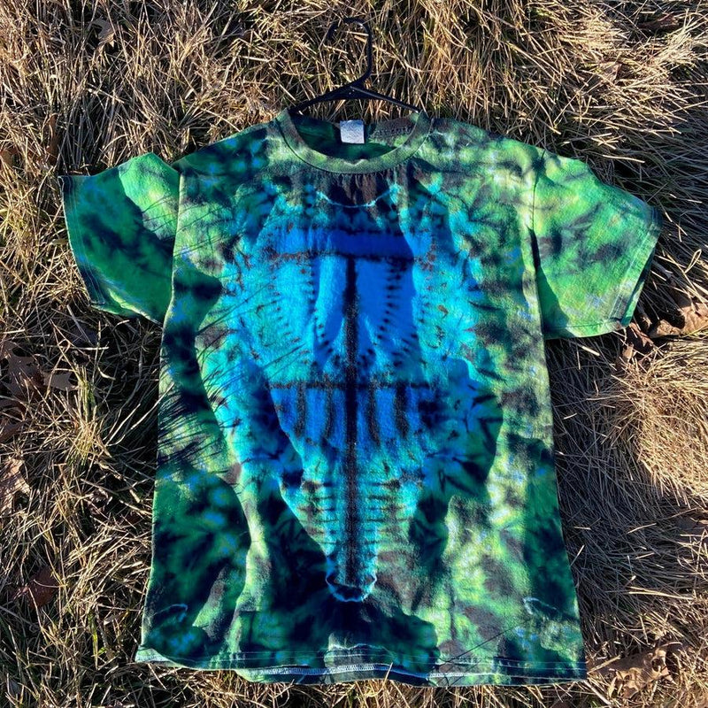 Vibrant blue and green tie-dye t-shirt with a "twisted amanita basket" pattern, showcasing a black hanger.