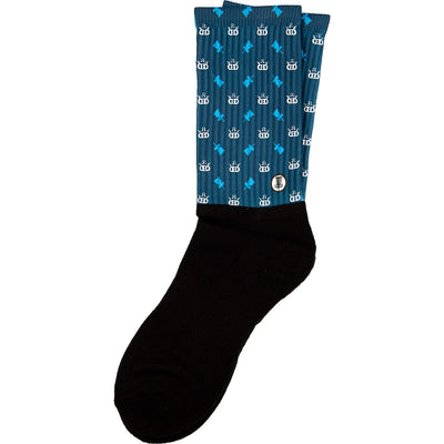 Black and blue Dynamic Discs Tee Box Sox with a repeating pattern of crowns and disc golf baskets.
