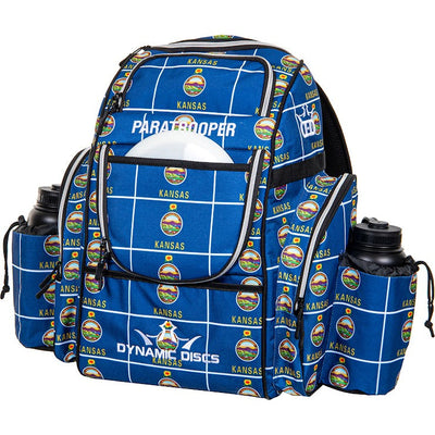 Blue Dynamic Discs Paratrooper backpack with "Kansas" and Sunflower State seals pattern, featuring two water bottles.