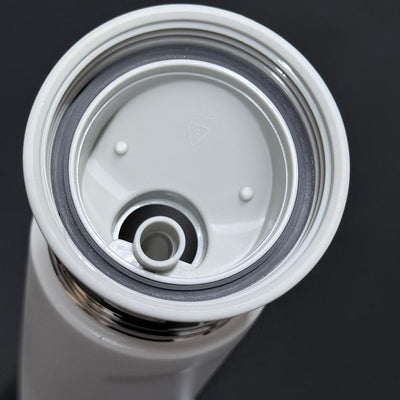 Top-down view of a Dynamic Discs Chug stainless steel water bottle with its white lid and gray rubber seal.