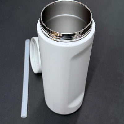 White Dynamic Discs Chug stainless steel water bottle with a silver rim, a clear straw, and an open lid.