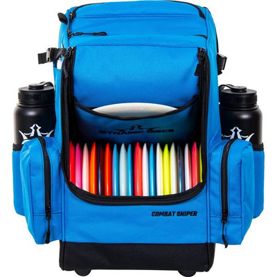Bright blue Dynamic Discs Combat Sniper backpack disc golf bag with colorful discs, two water bottles, and black accents.