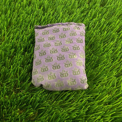 Purple Dynamic Discs Dirtbag Mini King DS, a rectangular bag, features a repeated pattern of faded olive green logos.