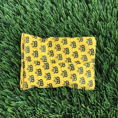 Yellow Dynamic Discs Dirtbag Mini King DS disc golf towel with repeating black crown pattern.