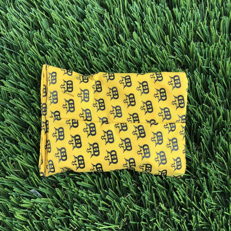 Yellow Dynamic Discs Dirtbag Mini King DS disc golf towel with repeating black crown pattern.