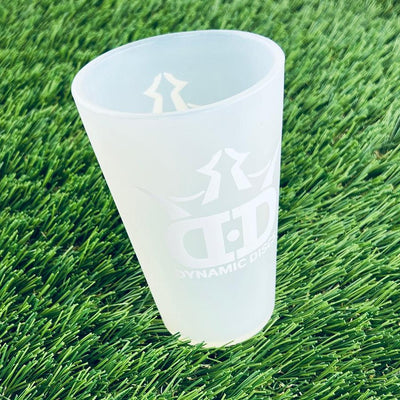 Frosted white Dynamic Discs Sili Pint with the brand's crown and lettered logo printed on the side.