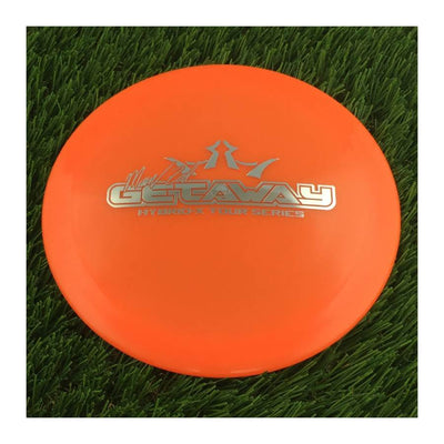 Translucent orange Dynamic Discs Hybrid X Getaway disc with Mason Ford Tour Series 2022 silver stamp.