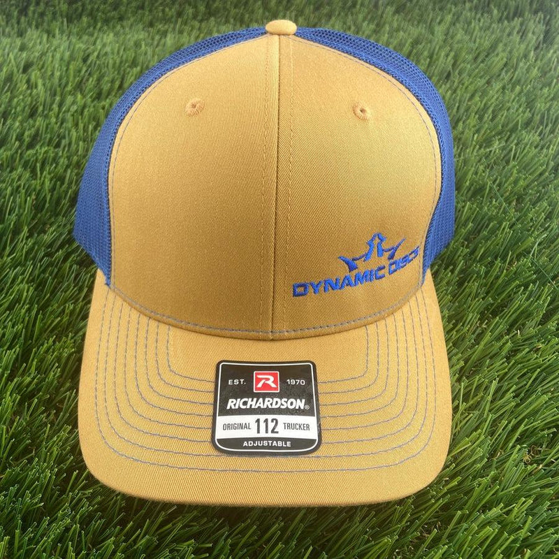 Mustard黄色 Dynamic Discs King DS snapback hat with blue mesh back and a blue embroidered logo.