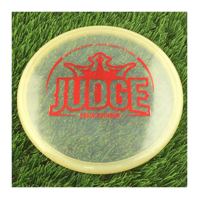 Translucent gold Dynamic Discs Lucid Confetti V2 Judge with a red Gavin Rathbun Big Judge 2023 Team Series stamp.