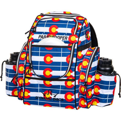 Dynamic Discs Paratrooper backpack disc golf bag with a blue, white, red, and yellow Colorado flag pattern.