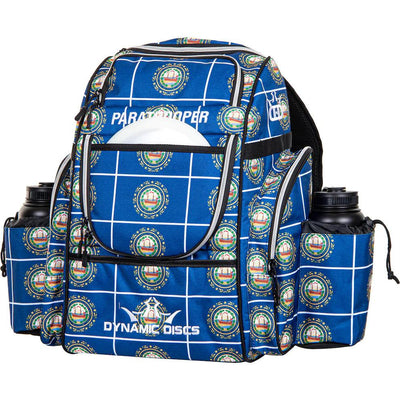 Dynamic Discs Paratrooper backpack in blue with white gridlines, repeating state seal pattern, and "Paratrooper" text.