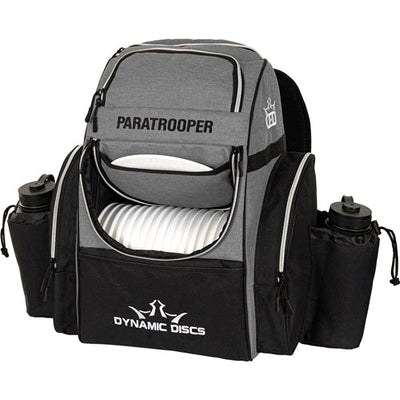 Gray and black Dynamic Discs Paratrooper disc golf bag with bottle holders and white discs.