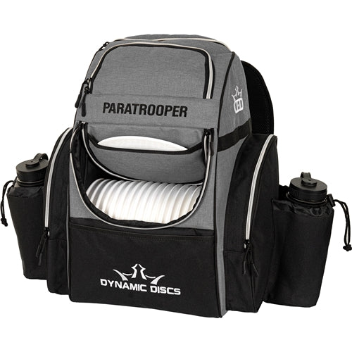 Gray and black Dynamic Discs Paratrooper disc golf bag with bottle holders and white discs.