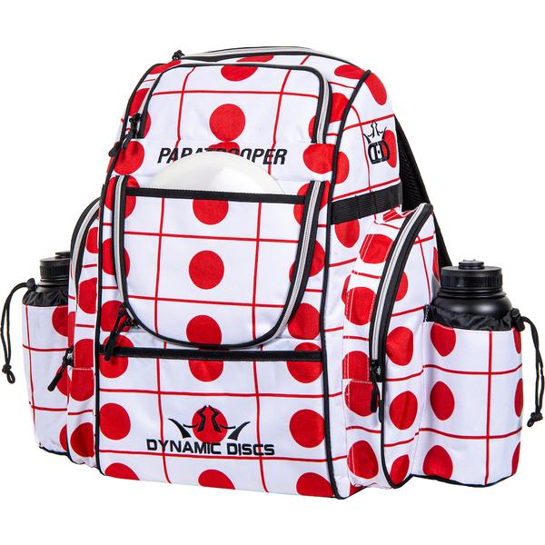 White Dynamic Discs Paratrooper backpack with red polka dots, red gridlines, and multiple zippered pockets.