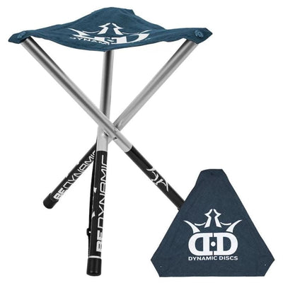 The Dynamic Discs Roll A Stool features a blue fabric seat with a white logo and silver aluminum legs with black grips.
