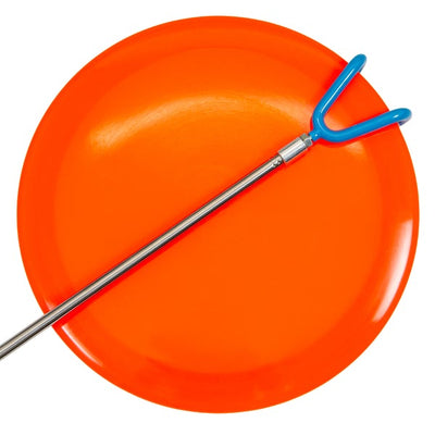 Dynamic discs telescoping retriever with a blue two-pronged claw and silver pole, resting on an orange disc golf frisbee.
