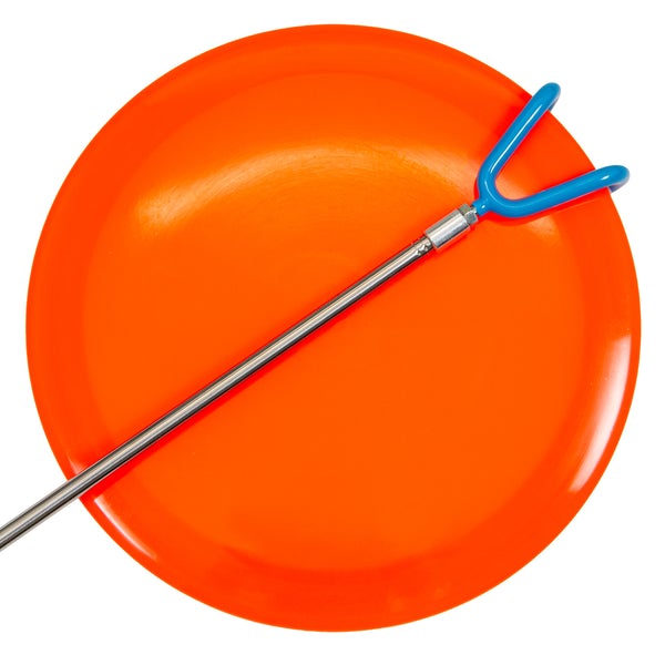 Dynamic discs telescoping retriever with a blue two-pronged claw and silver pole, resting on an orange disc golf frisbee.