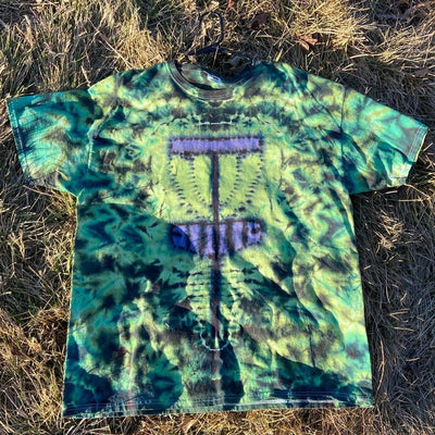 Green and black tie-dye T-shirt with a purple disc golf basket graphic and the word "DISC" in capital letters.