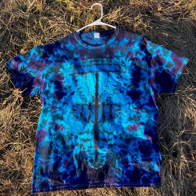 A vibrant twisted amanita mushroom basket style dysket t-shirt in varying shades of blue, teal, and deep purple.