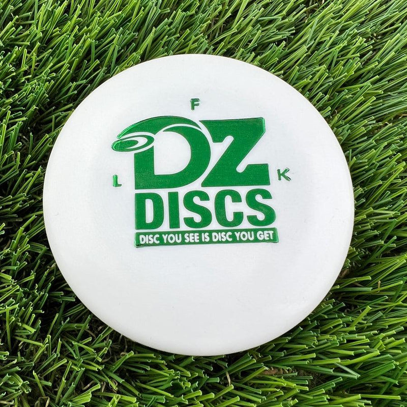 White dzdiscs mini marker disc with a bold green "DZ DISCS" logo and "DISC YOU SEE IS DISC YOU GET" text.