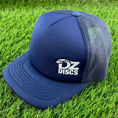 Navy blue Yupoong foam trucker snapback cap with a white DZ Discs logo and a mesh back panel.
