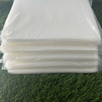Stacked transparent, 4 mil polyethylene bags for discs, measuring 9 by 12 inches individually.