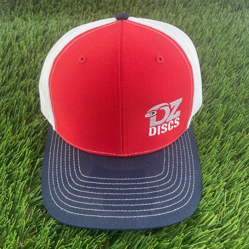 Red dzdiscs Richardson 112 meshback snapback hat featuring a navy bill with white stitching and white mesh.