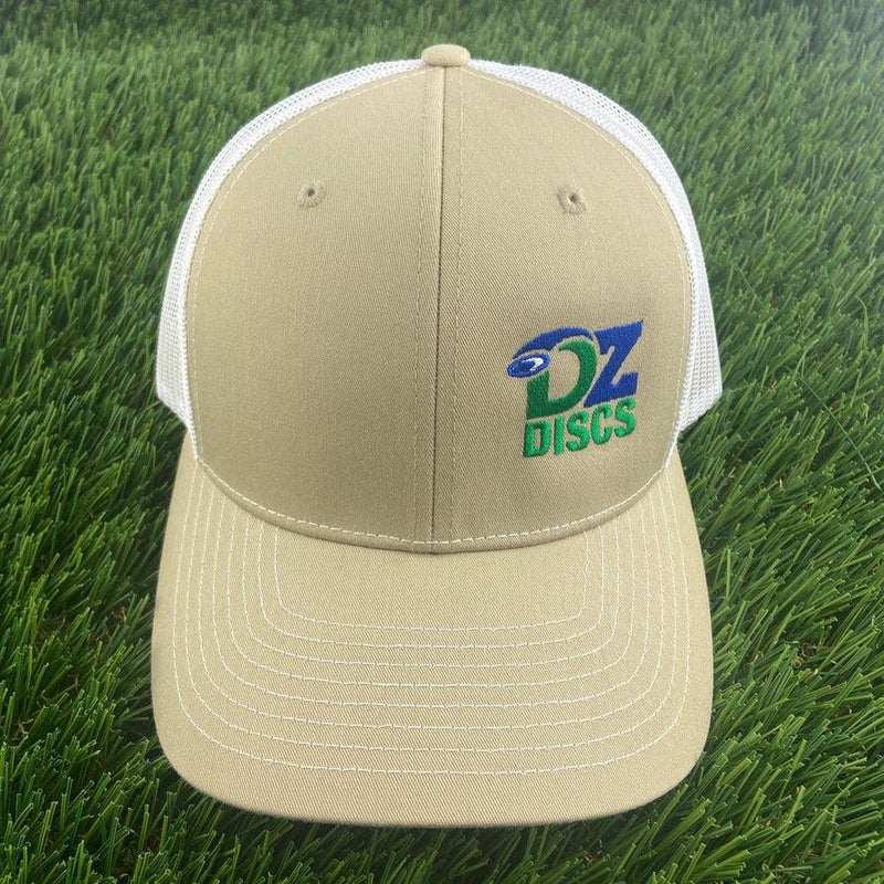 Tan and white Richardson 112 meshback snapback hat with a blue and green DZ DISCS logo.