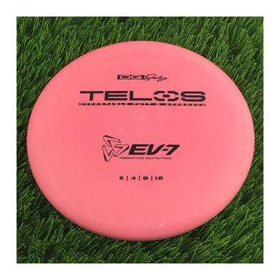 Solid pink EV-7 OG Base Telos 174g disc golf putter with a black oval stamp displaying flight numbers.
