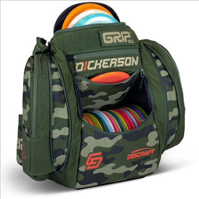Grip EQ AX5 Chris Dickerson Signature Series disc golf bag in green camouflage with various colored discs.