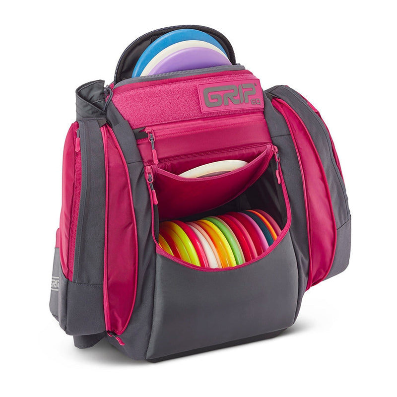 Dark gray Grip EQ AX5 series disc golf backpack with vibrant magenta accents, multiple compartments, and colorful discs.