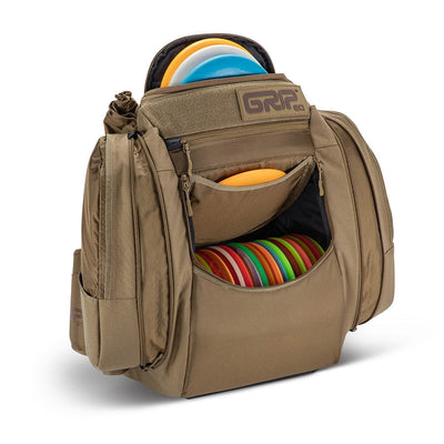 Tan Grip EQ AX5 Series Tour Bag backpack with multiple zippered pockets and colorful discs visible.