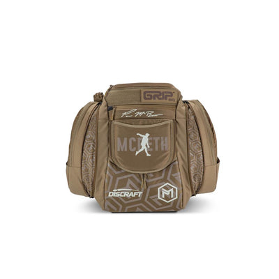 Brown Grip EQ AX5 Series Tour backpack with a geometric pattern, Paul McBeth signature, and Discraft logo on the front.