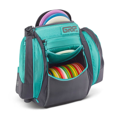 Teal and charcoal gray GRIP EQ AX5 Series Tour disc golf backpack with various compartments holding colorful discs.