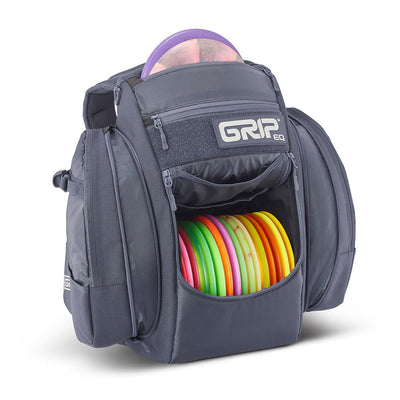 Gray GRIPeq BX3 Series disc golf backpack with various pockets holding colorful discs and one purple disc on top.