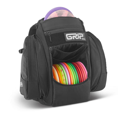 Black GripEQ BX3 Series Tour Bag backpack with a purple disc in the top pocket and multi-colored discs in the front pocket.