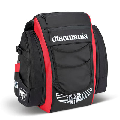 Black and red Discmania BX3 Jetpack Tour disc golf bag with multiple zippered pockets and embroidered logos.