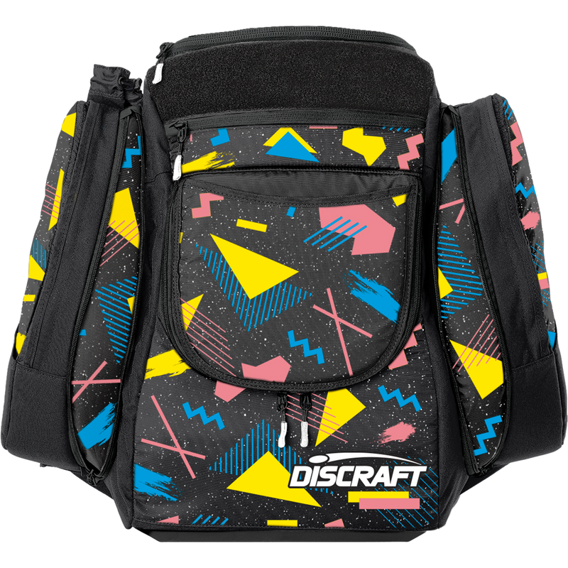 Discraft AX5 disc golf bag in black with a vibrant 80s geometric pattern, featuring pink, yellow, and blue shapes.