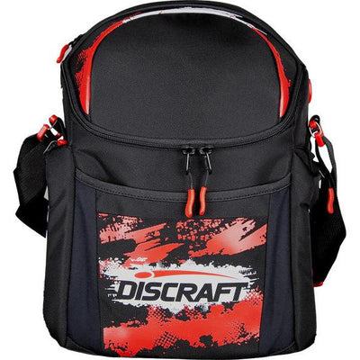 Black GRIPeq Discraft G2 disc golf bag with a red and white splatter pattern and red zipper pulls.
