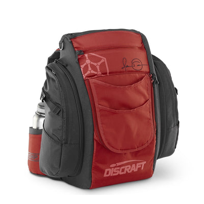 Red and black Grip EQ Discraft Nate Doss Signature Edition Tour Bag with multiple zippered pockets and a water bottle.