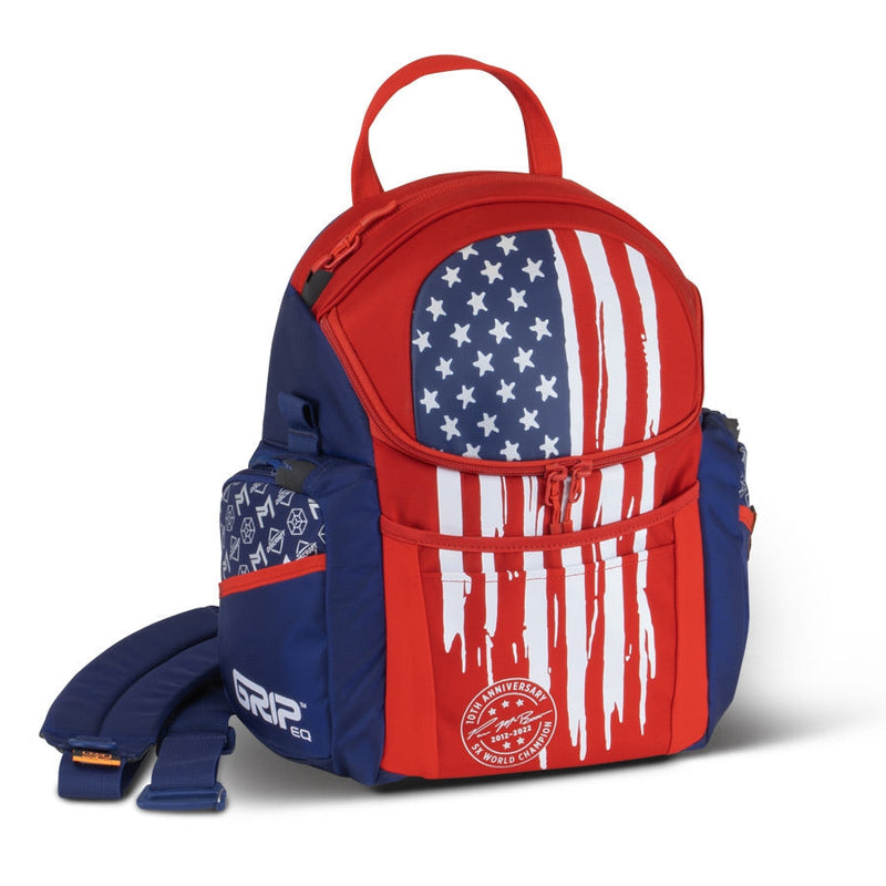 Red and blue GRIP EQ Paul McBeth 10 Year Anniversary disc golf bag with a distressed American flag design.