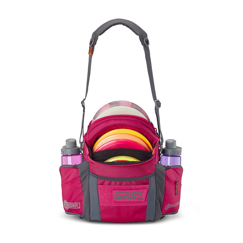 Magenta GRIPeq G2 Series disc golf bag with gray accents, two water bottle holders, and colorful discs inside.