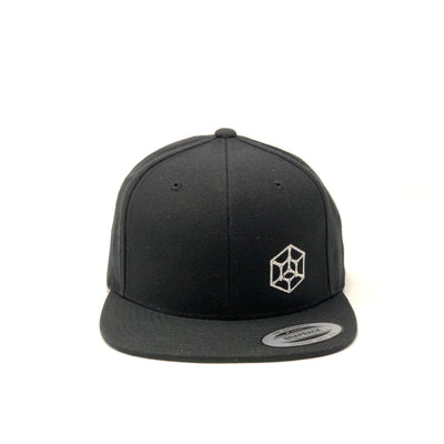 Black grip eq small hexicon flat bill snap back hat with a white embroidered hexagonal logo on the front.