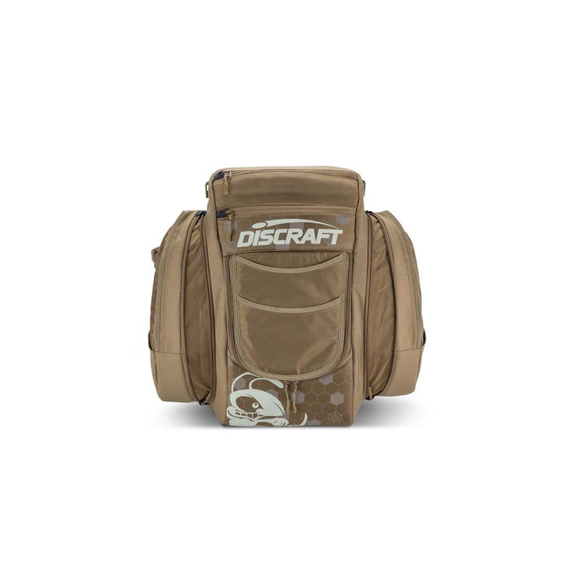 Brown GripEQ Discraft Buzzz BX3 disc golf bag with a Discraft logo, a skull graphic, and zippered pockets.
