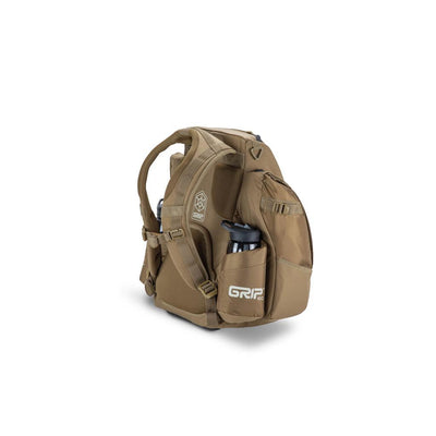 Tan GripEQ Discraft Buzzz BX3 disc golf backpack with a black water bottle in a side pocket.