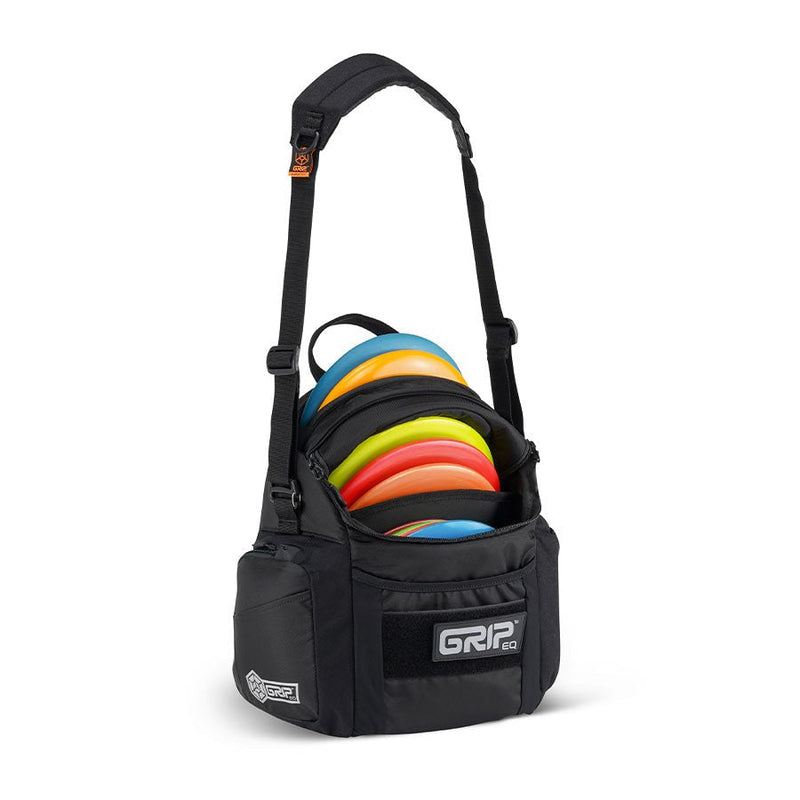 Black GRIPeq G2 Series disc golf bag with colorful discs inside its main pocket and a padded shoulder strap.