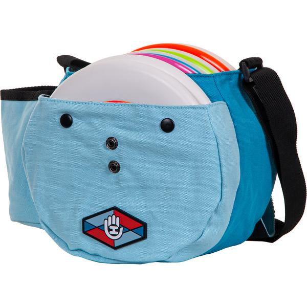 Light blue Handeye Bindle Bag open to display a row of white disc golf discs with colorful rims.