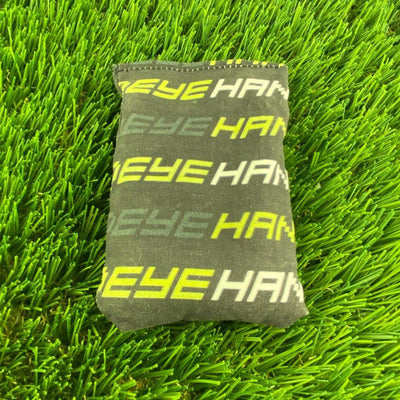 Handeye Dirtbag wordmark, a rectangular dark gray bag with repeating "EYEHAN" text in green and yellow.