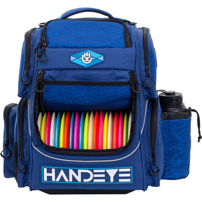 Blue Handeye Mission Rig backpack with two rows of colorful disc golf discs and a black water bottle.