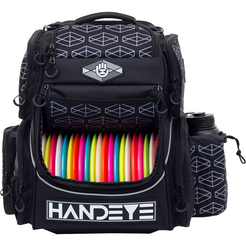 Black Handeye Mission Rig backpack holding assorted colorful disc golf discs and a water bottle.